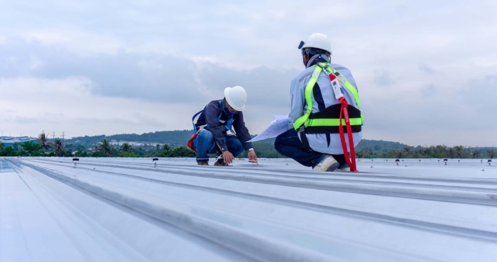 Two engineers wearing full safety body