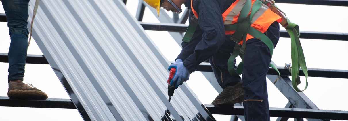 Construction worker building a part of a commercial roof