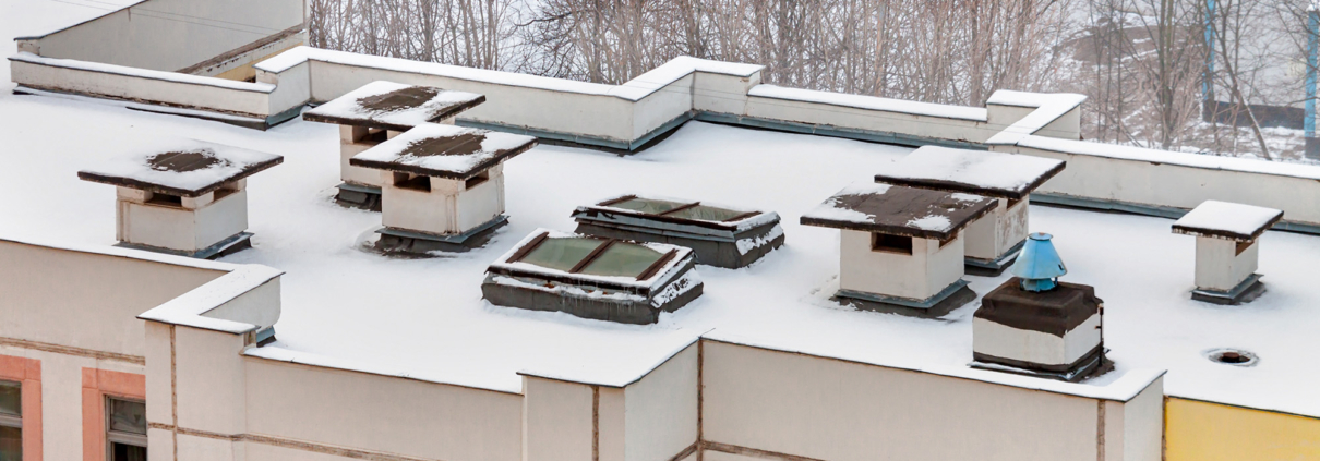 Aerial view winter flat roof kindergarten in residential district
