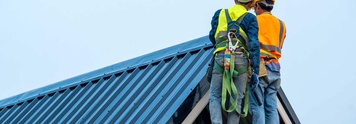 Side view of two roof inspectors