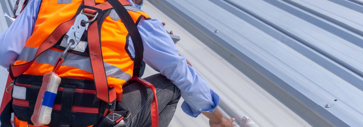 Workers inspecting roof leak