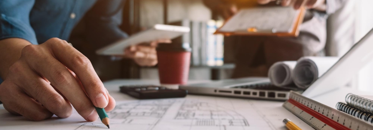 Workers looking at construction plans