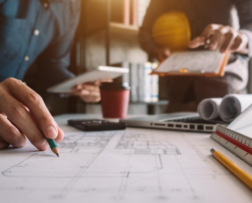 Workers looking at construction plans